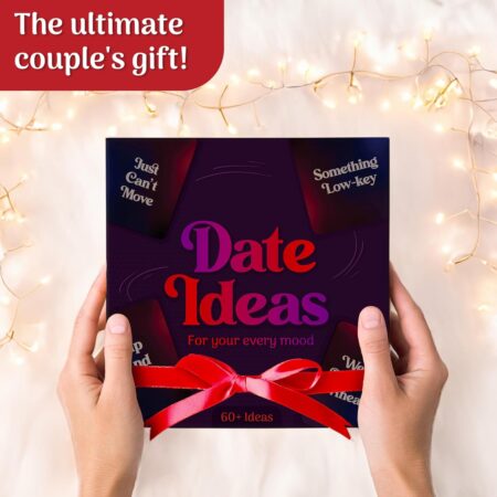 Couple laughing while pulling a date idea card