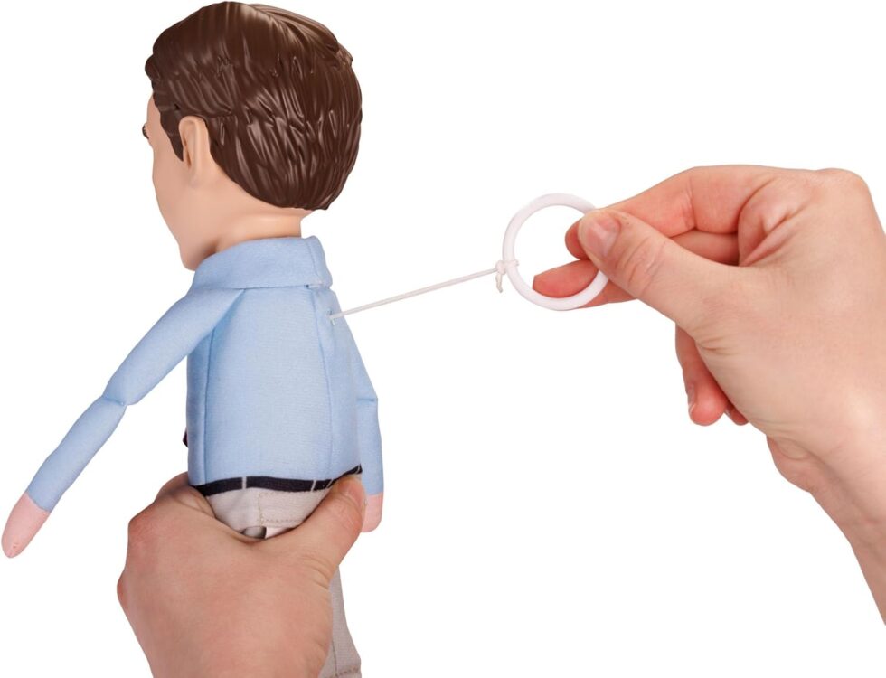 Back view of 40 Year Old Virgin doll showing pull string mechanism