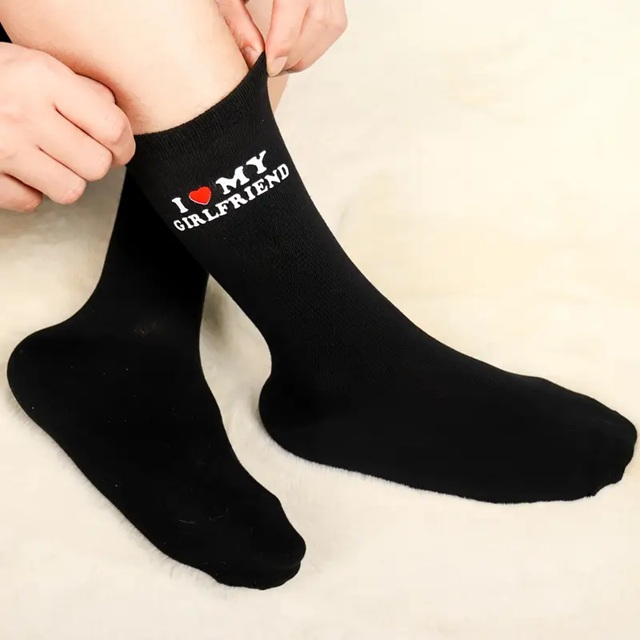 Black socks with red heart and bold white text