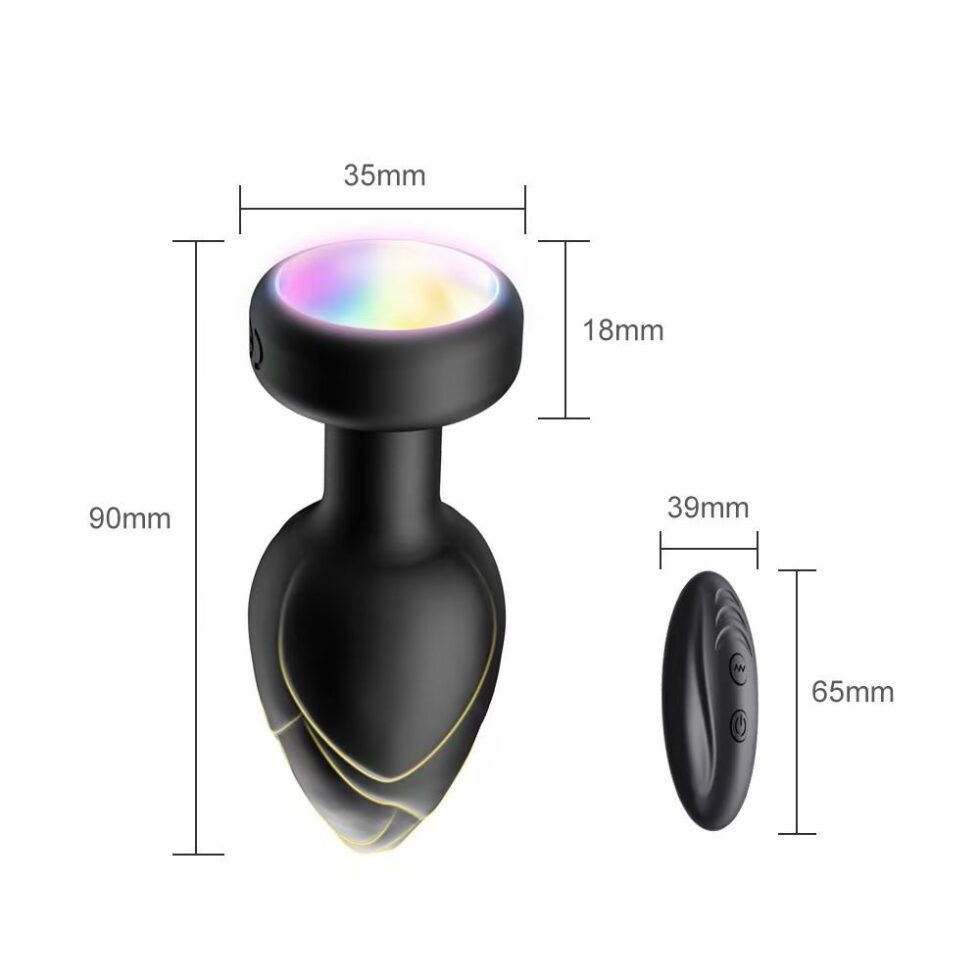 Close-up of colorful glowing base on black silicone anal plug showing multicolor light effect