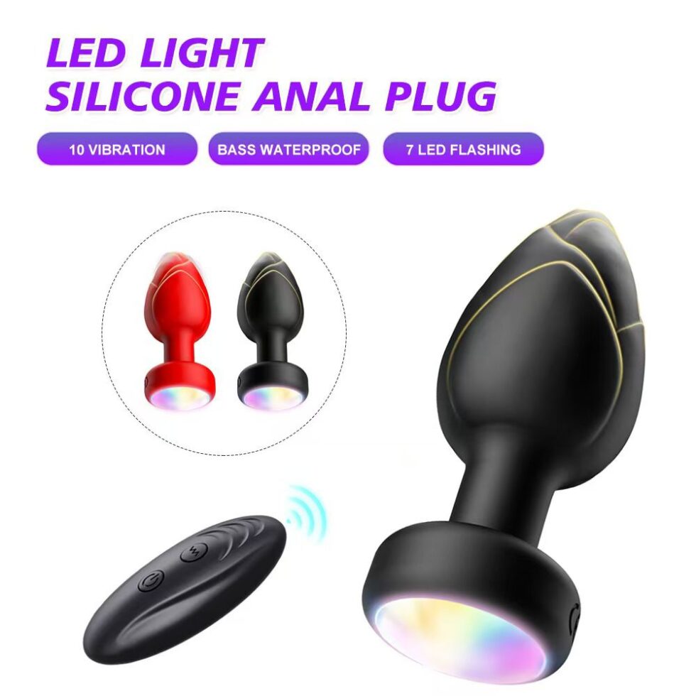 Black silicone anal plug with colorful glowing base and wireless remote shown in product feature image