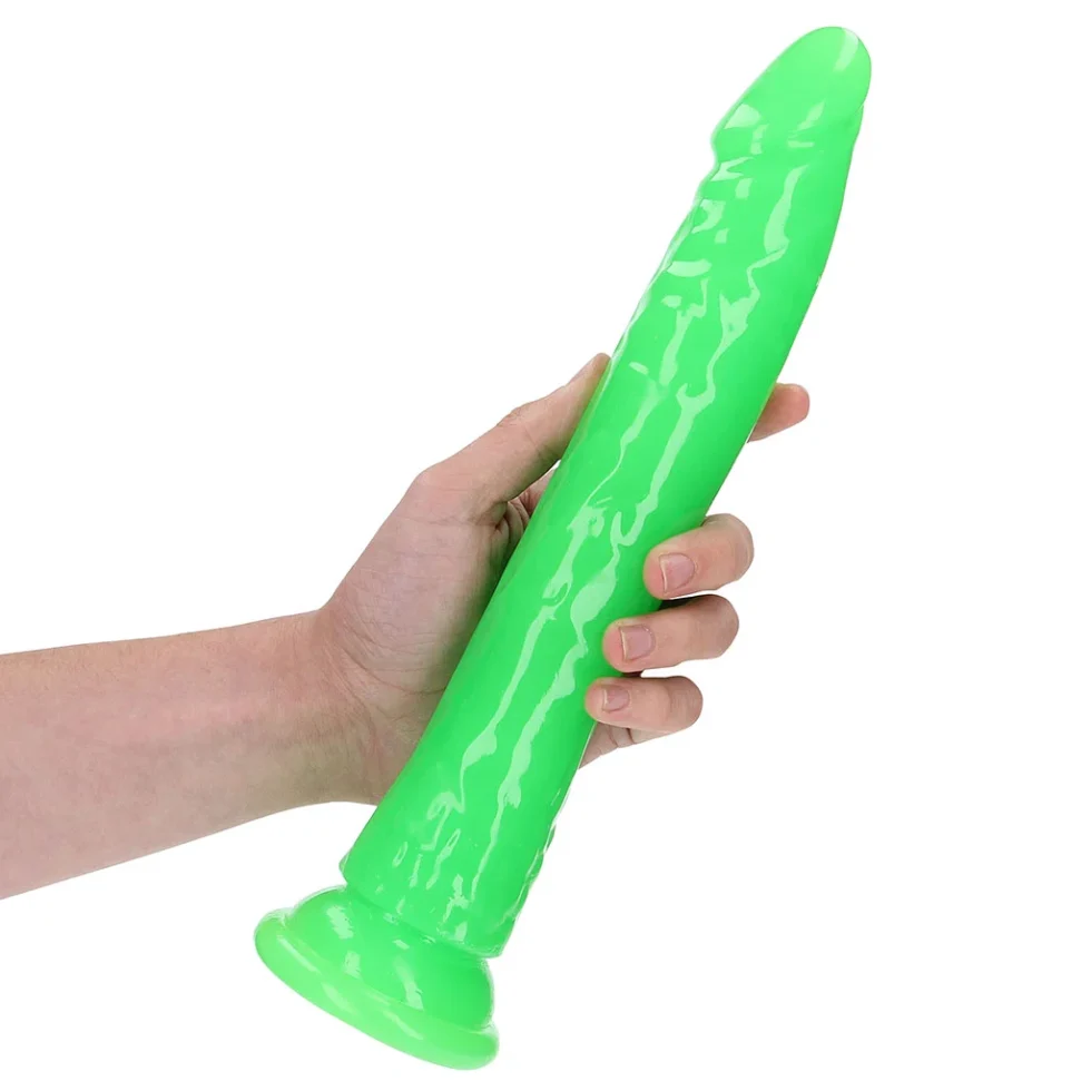 RealRock 10-inch glow-in-the-dark green dildo shown in hand