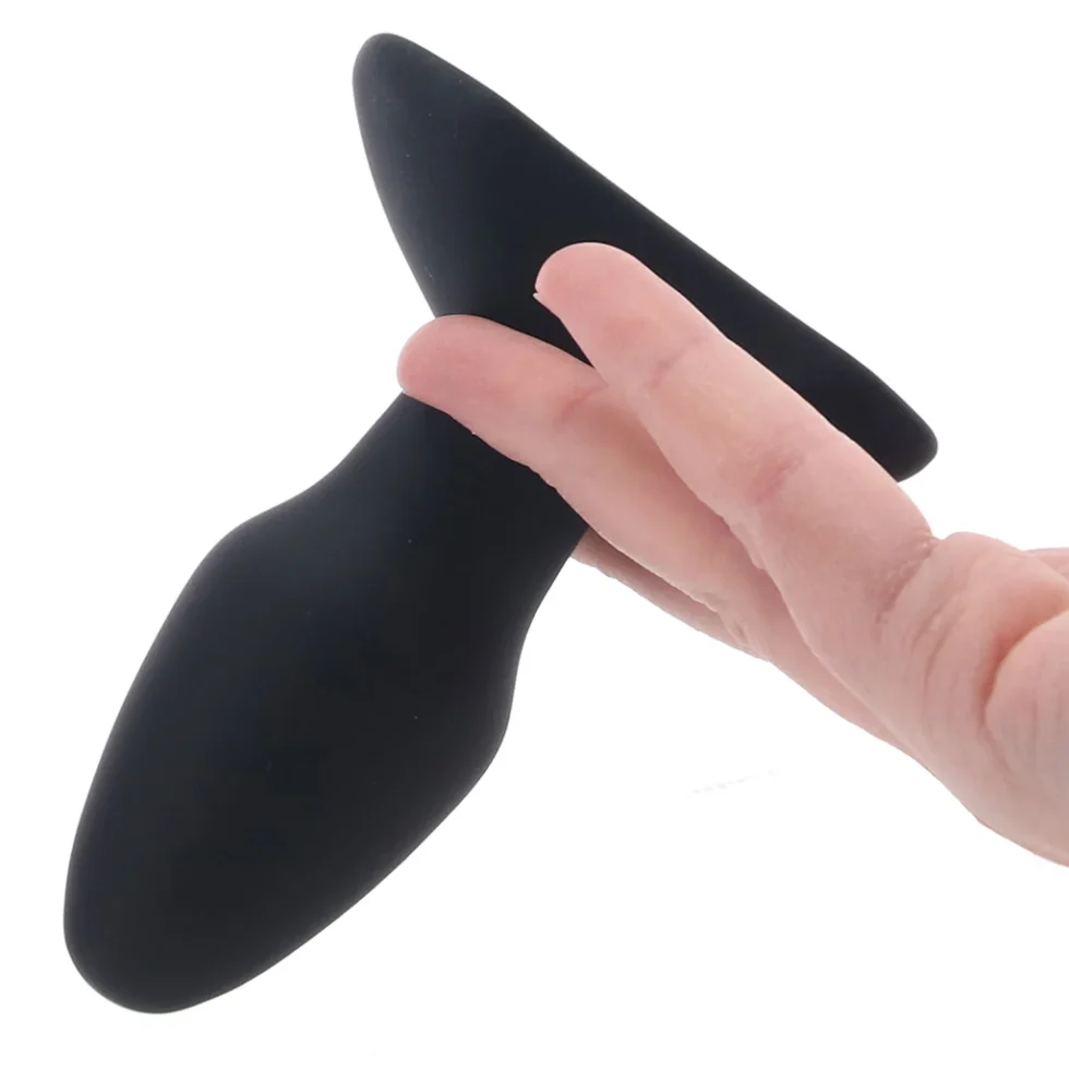 Vibration control button beneath the CalExotics tapered butt plug