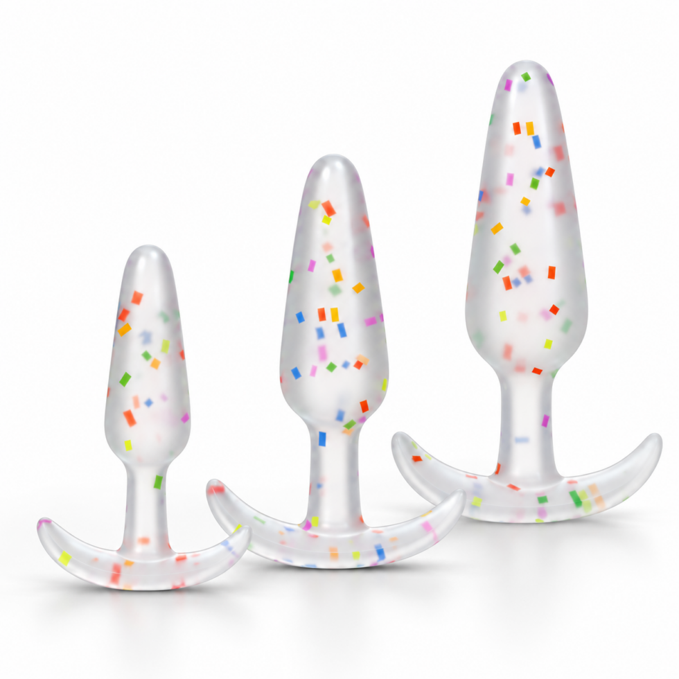 Three translucent confetti-patterned Mood Pride anal trainers in small, medium and large sizes on a white background.